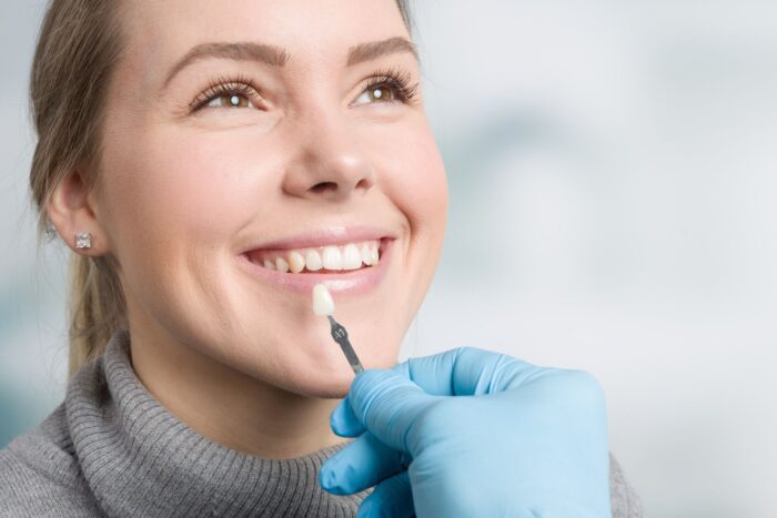 woman smiling while receiving cosmetic consultation dentist in Philadelphia Pennsylvania